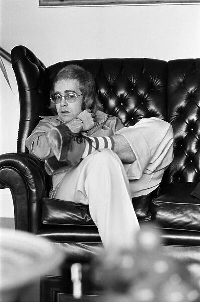 Elton John, singer, pictured at home in Virginia Water. 20th March 1973
