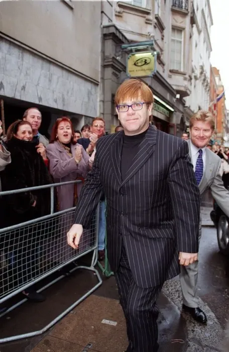 Framed Print : Elton John Singer  /  Songwriter attending the sale of his old cloths with the profits going