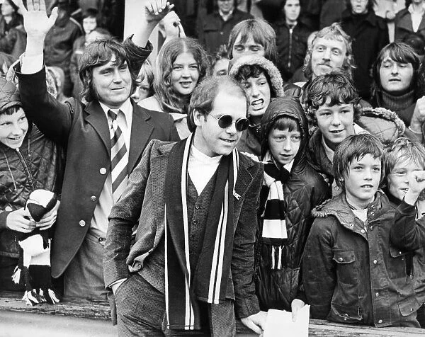 Elton John, singer and songwriter pictured with Watford Football supporters in Darlington