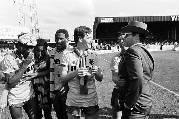 Elton John and some of the Watford side after their match against Liverpool