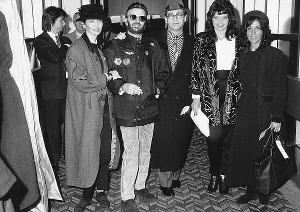 Elton John with wife and friends Ringo Starr about to board Concorde