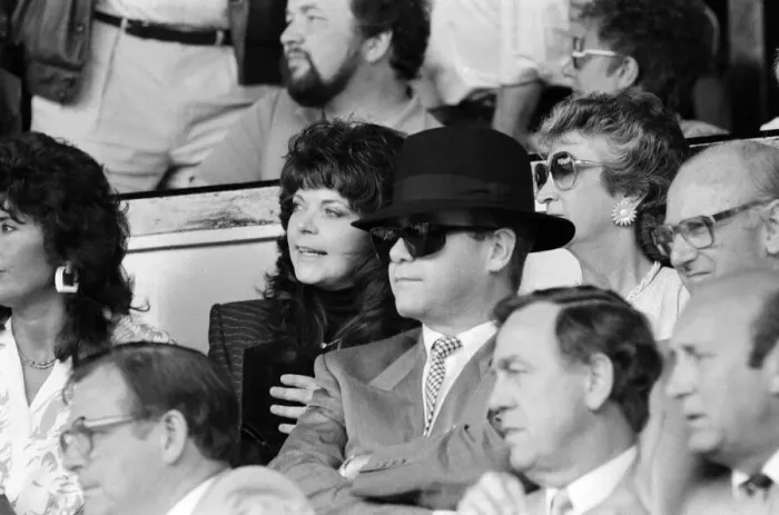 Framed Print : Elton John and his wife Renate watching his team, Watford, play Tottenham Hotspur