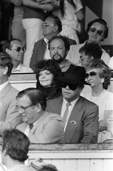 Elton John and his wife Renate watching the Watford v Tottenham Hotspur match
