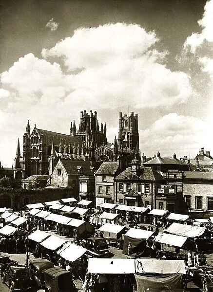 Ely Cathedral Cambridgeshire over looking the town square on a market day