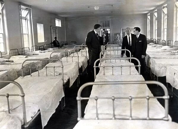 Ely Hospital - in 1969. and officials inspect overcrowding in a mens ward