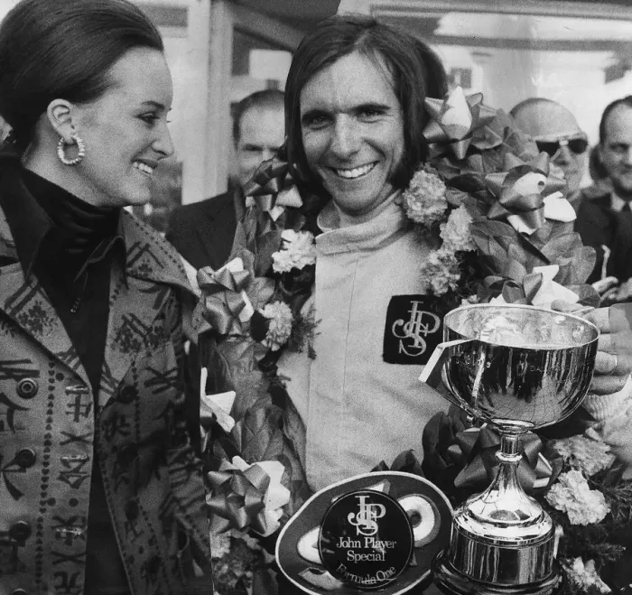 Framed Print : Emerson Fittipaldi wins the British Grand Prix at Brands Hatch stands with wife Marina