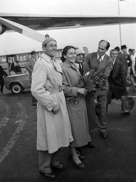 Emil Zatopek arrives for the London meeting with his wife Dana. 11th October 1955