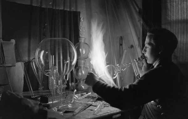 A employee of Scientific Supplies of Hatton Garden, seen here glass blowing