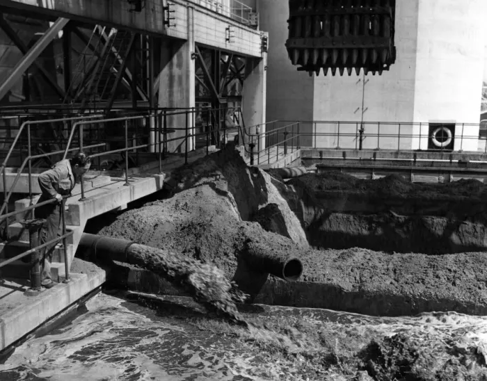 Framed Print : One of the employees at the Aberthaw power station watched the used ash mixed with water Framed Print : One of the employees at the Aberthaw power station watched the used ash mixed with water