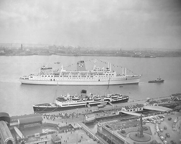 The Empress of Canada seen here being towed to the quayside on the River Mersey at