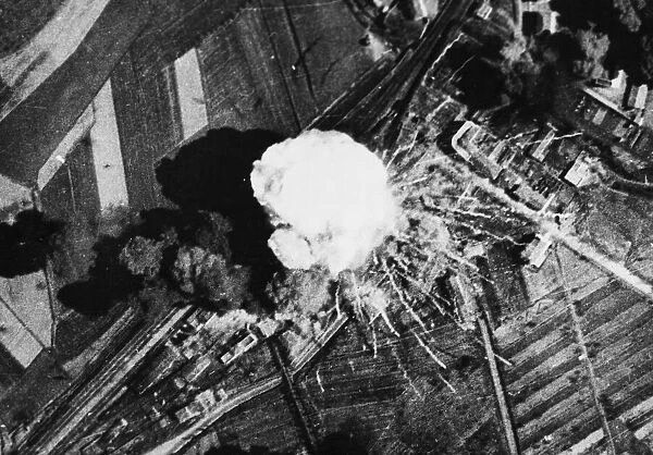 An enemy ammunition train goes up in a puff of white smoke when hit directly in a bombing