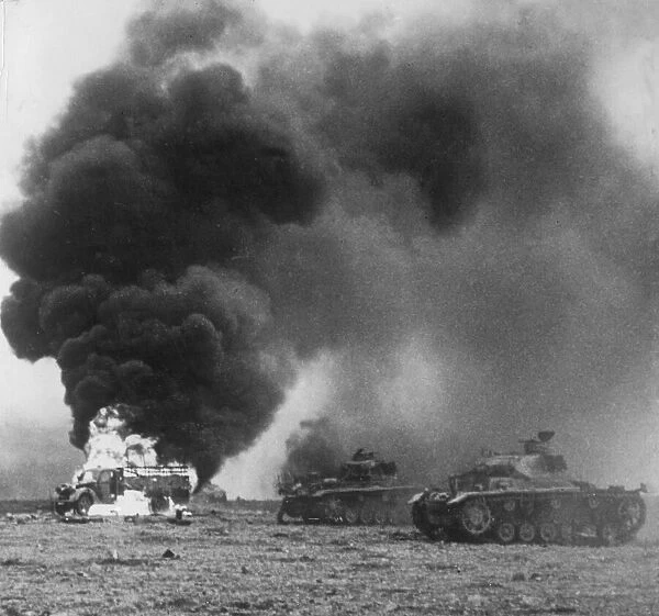 Enemy tanks ablaze during a battle in Cyrenaica in Libya during the Second World War