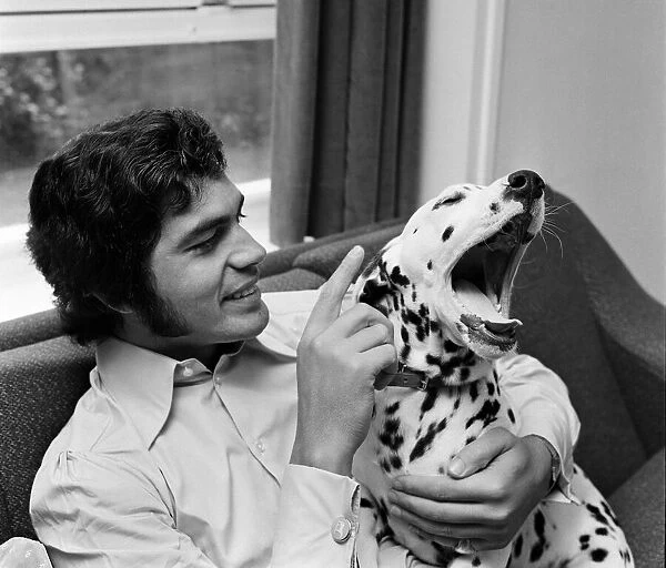 Engelbert Humperdinck at home with his Dalmatian dog. 5th July 1968
