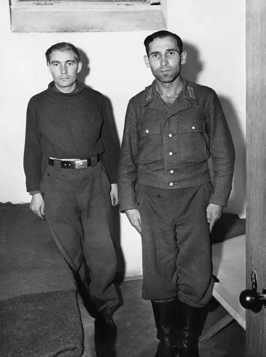 Framed Print : Engelbert Nadermayer (right) who was formerly in charge of the notorious crematorium at Dachau, shown in his cell alongside a former SS trooper who is also on the list of war criminals to be tried. 20th September 1945 Framed Print : Engelbert Nadermayer (right) who was formerly in charge of the notorious crematorium at Dachau, shown in his cell alongside a former SS trooper who is also on the list of war criminals to be tried. 20th September 1945