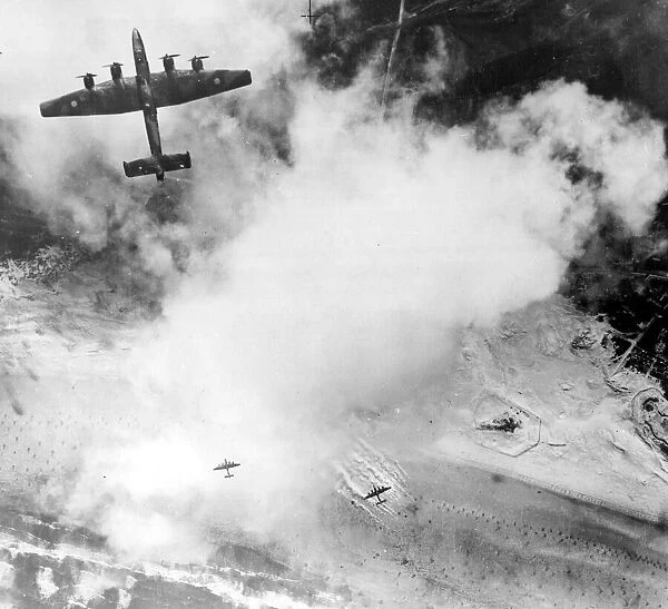 A four engined Halifax bomber attacking fortified positions at Calais in Northern France