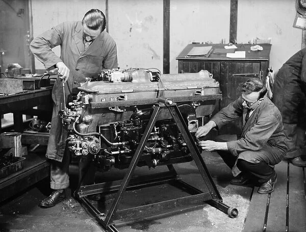 Engineer check the Gipsy Six engine during the construction of the Miles 3 Falcon