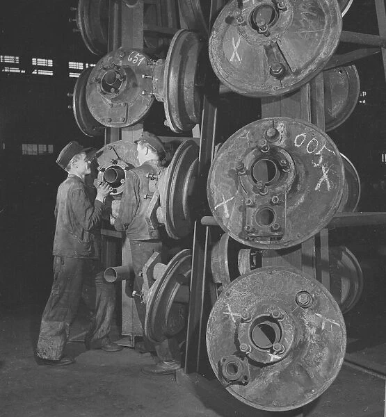 Engineers seen here selecting wheels at the Lowa Montages Fabrik Steam Locomotive repair