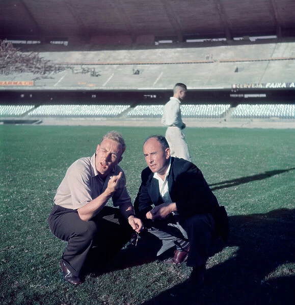 England captain Billy Wright inspects the pitch at the newly opened Maracana Stadium in