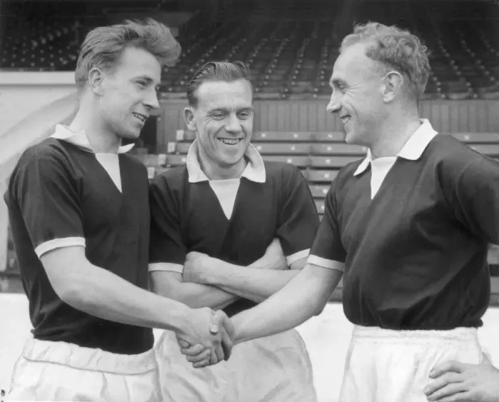 Framed Print : England captain Billy Wright (right) shakes hands with new recruit Bobby Charlton of Framed Print : England captain Billy Wright (right) shakes hands with new recruit Bobby Charlton of