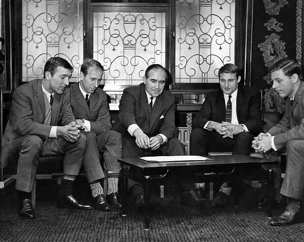 England football manager Alf Ramsey discusses tactics with England players Peter Thompson