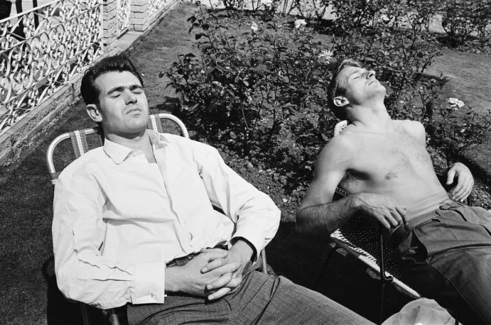 Framed Print : England football players John Connelly (left) and Roger Hunt sunbathing at their base in Framed Print : England football players John Connelly (left) and Roger Hunt sunbathing at their base in