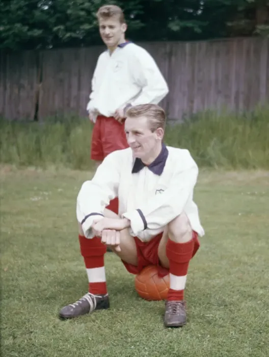 Framed Print : England football team training. George Eastham sitting down, watched by Roger Hunt Framed Print : England football team training. George Eastham sitting down, watched by Roger Hunt