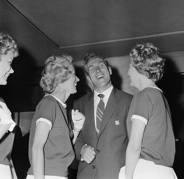 England footballer Billy Wright is greeted by his girlfriend Joy of the Beverley Sisters
