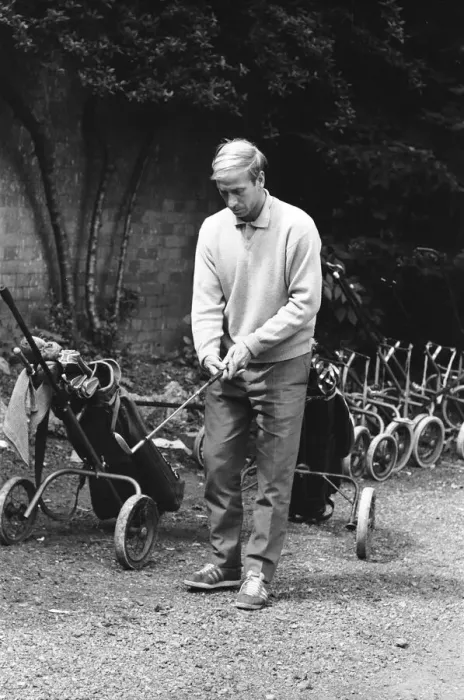 Framed Print : England footballer Bobby Charlton chosses his club as enjoys a round of golf during an Framed Print : England footballer Bobby Charlton chosses his club as enjoys a round of golf during an