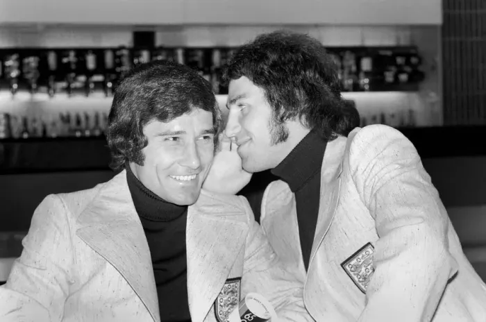 Framed Print : England footballer Gerry Francis whispers into new boy Colin Viljoen Framed Print : England footballer Gerry Francis whispers into new boy Colin Viljoen