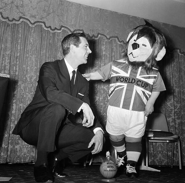 Former England footballer Johnny Haynes pictured with World Cup Willie