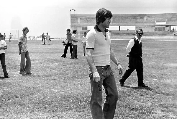 England footballer Malcolm MacDonald inspects the pitch before the European Championship