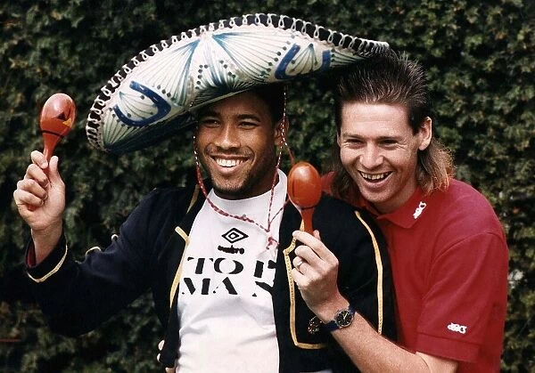 England footballers John Barnes and Chris Waddle take a break during an England training