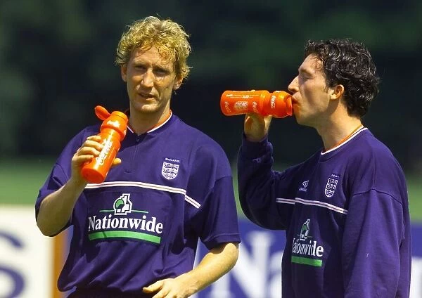England footballers Robbie Fowler (right) and Ray Parlour during a training session at