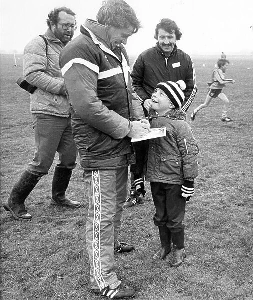 England manager Bobby Robson obliges a young fan in Newcastle