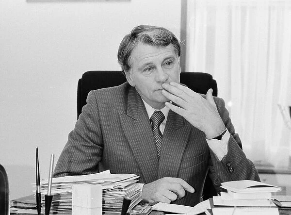 England manager Bobby Robson sitting at his busy desk as he gets prepared for his
