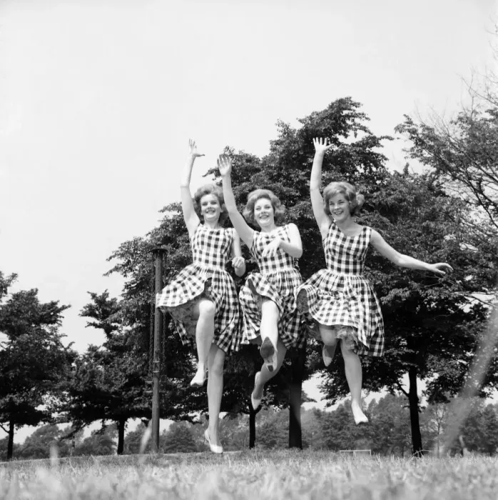 Framed Print : England Sisters jump for joy to celebrate their chart success: The Sisters from left