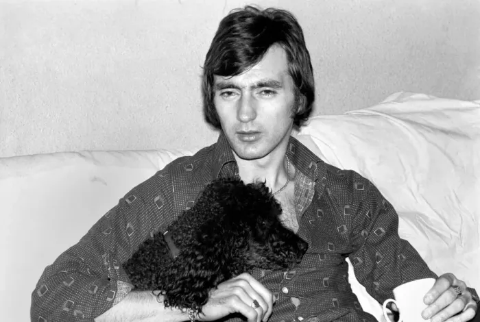 Framed Print : England and Stoke international hero Alan Hudson seen here with his pet poodle Framed Print : England and Stoke international hero Alan Hudson seen here with his pet poodle