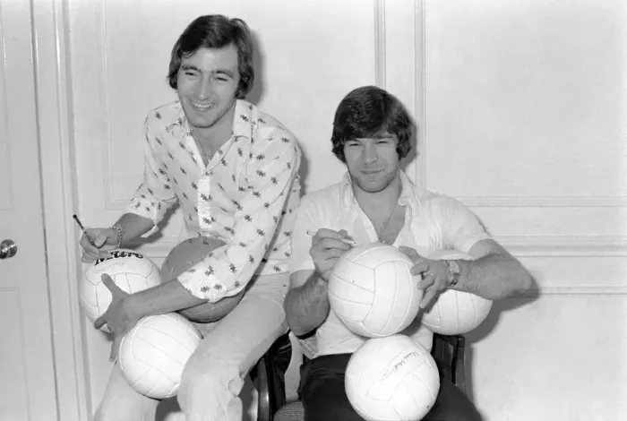 Framed Print : England team at hotel: Alan Hudson left and Malcolm MacDonald sign match footballs Framed Print : England team at hotel: Alan Hudson left and Malcolm MacDonald sign match footballs
