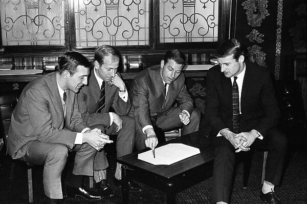 England team manager Alf Ramsey talks over tactics at a Liverpool hotel with (l to r