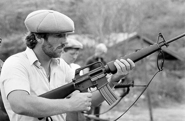 England in West Indies 1981. Ian Botham with the England team trying out some guns