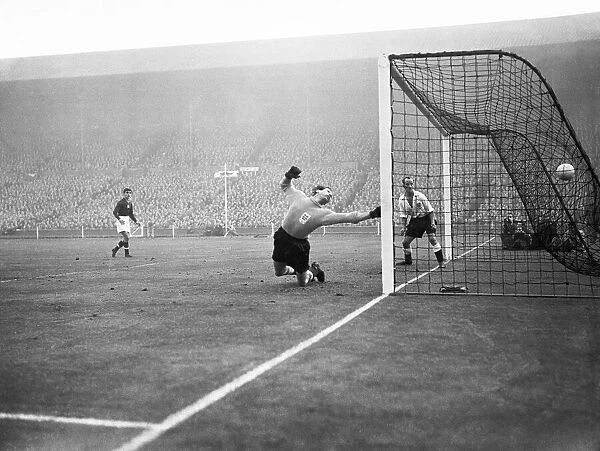 Englands goalkeeper Gilbert Merrick is unable to prevent Hungry scoring a goal