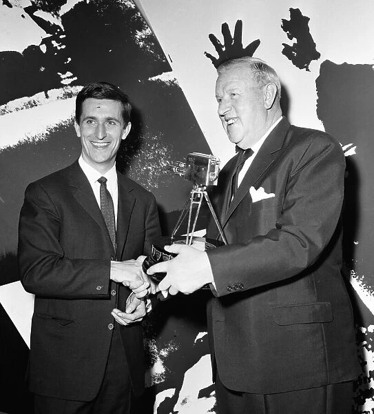 English cyclist Tommy Simpson receives the 1965 Sports Personality of the Year trophy