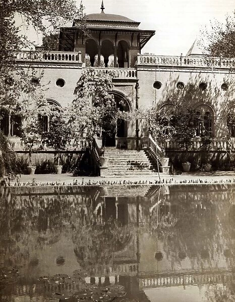 The English Embassy is reflected in the ornamental lake in Tehran Architecture