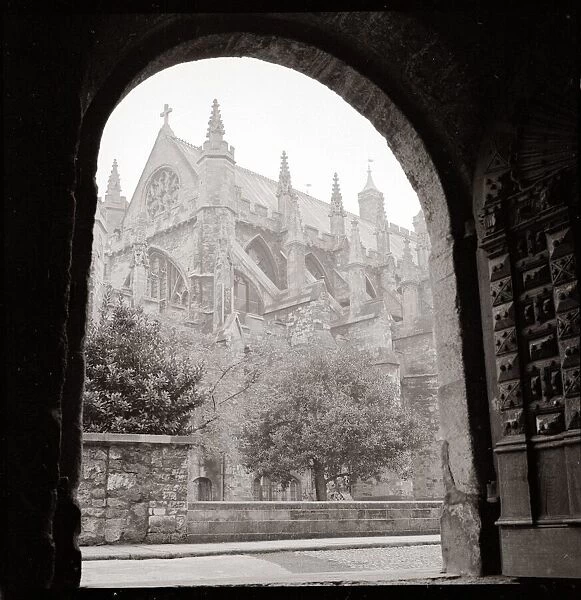English gothic Cathedral seen from underneath an archway England towns church