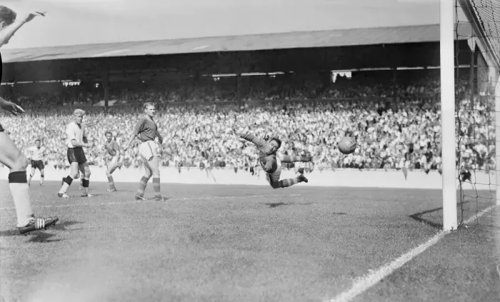 Framed Print : English League Division One match. Burgin the Leeds goalie turns in mid air to see Framed Print : English League Division One match. Burgin the Leeds goalie turns in mid air to see