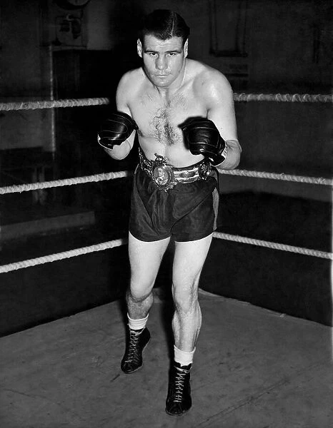 English middleweight boxer Vince Hawkins wearing his belt