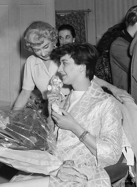 English playwright Shelagh Delaney receives a bouquet of flowers on the first night of