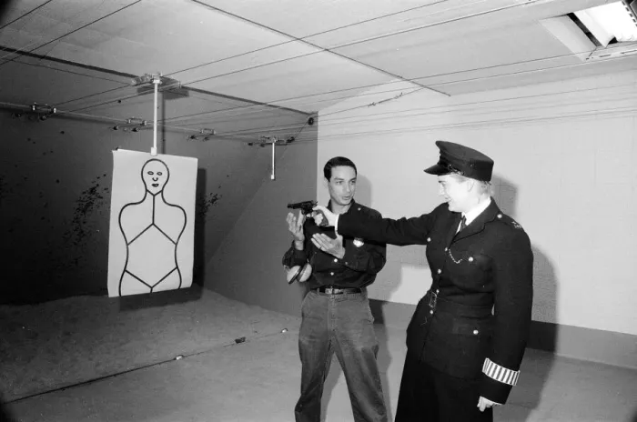 Framed Print : English police officers tour a firing range at a New York Police Department in America