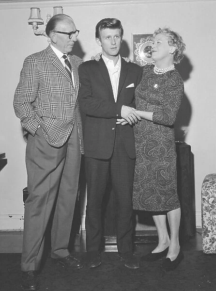 English pop singer Johnny Leyton with his separated mother and father Stanley and Mary