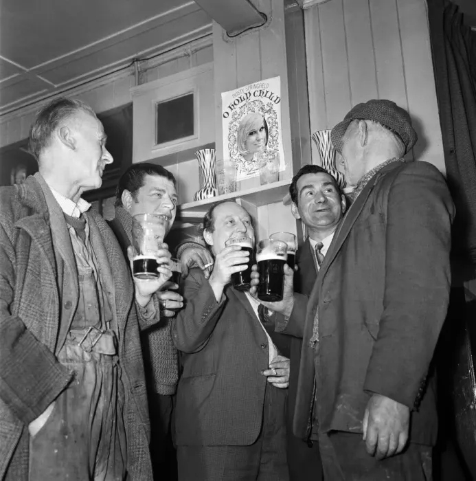 Framed Print : Enjoying a drink in the Subway club, meeting place for fisherman and dockers. March 1965